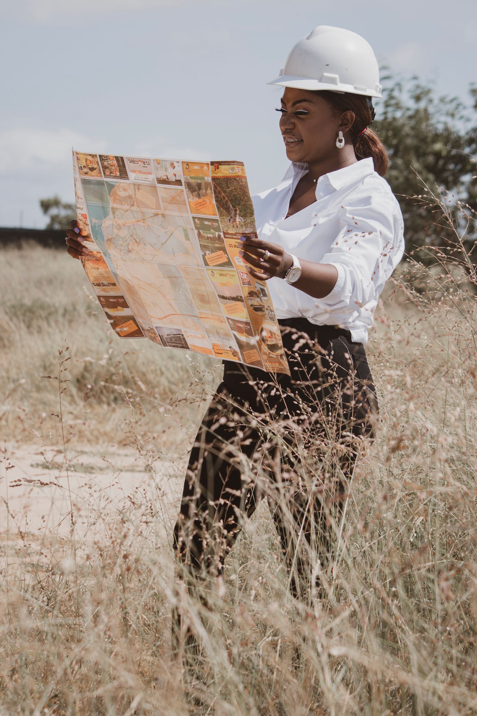 A Gulam Energy engineer reviewing project plans on site