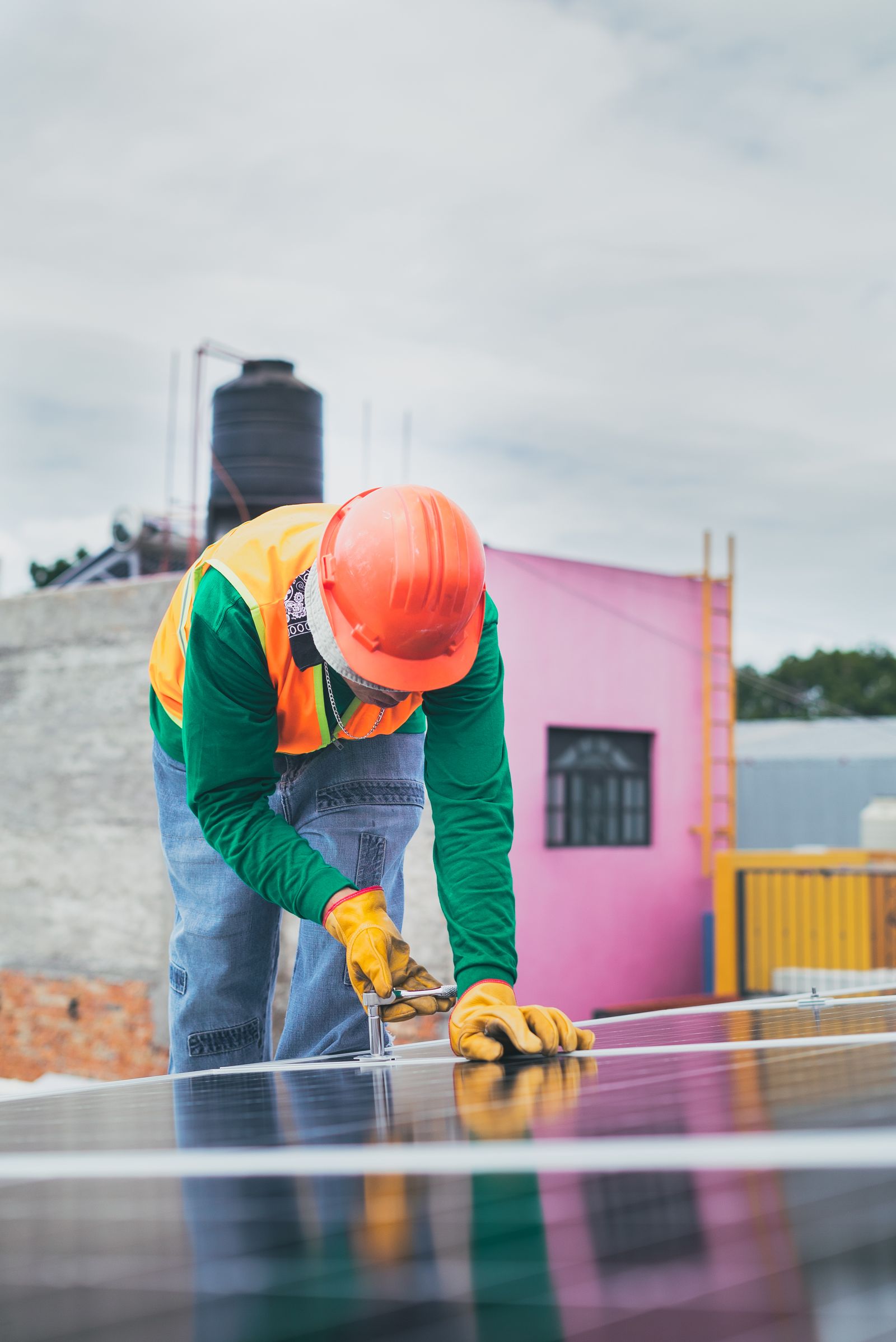 Technician handling a solar panel on site