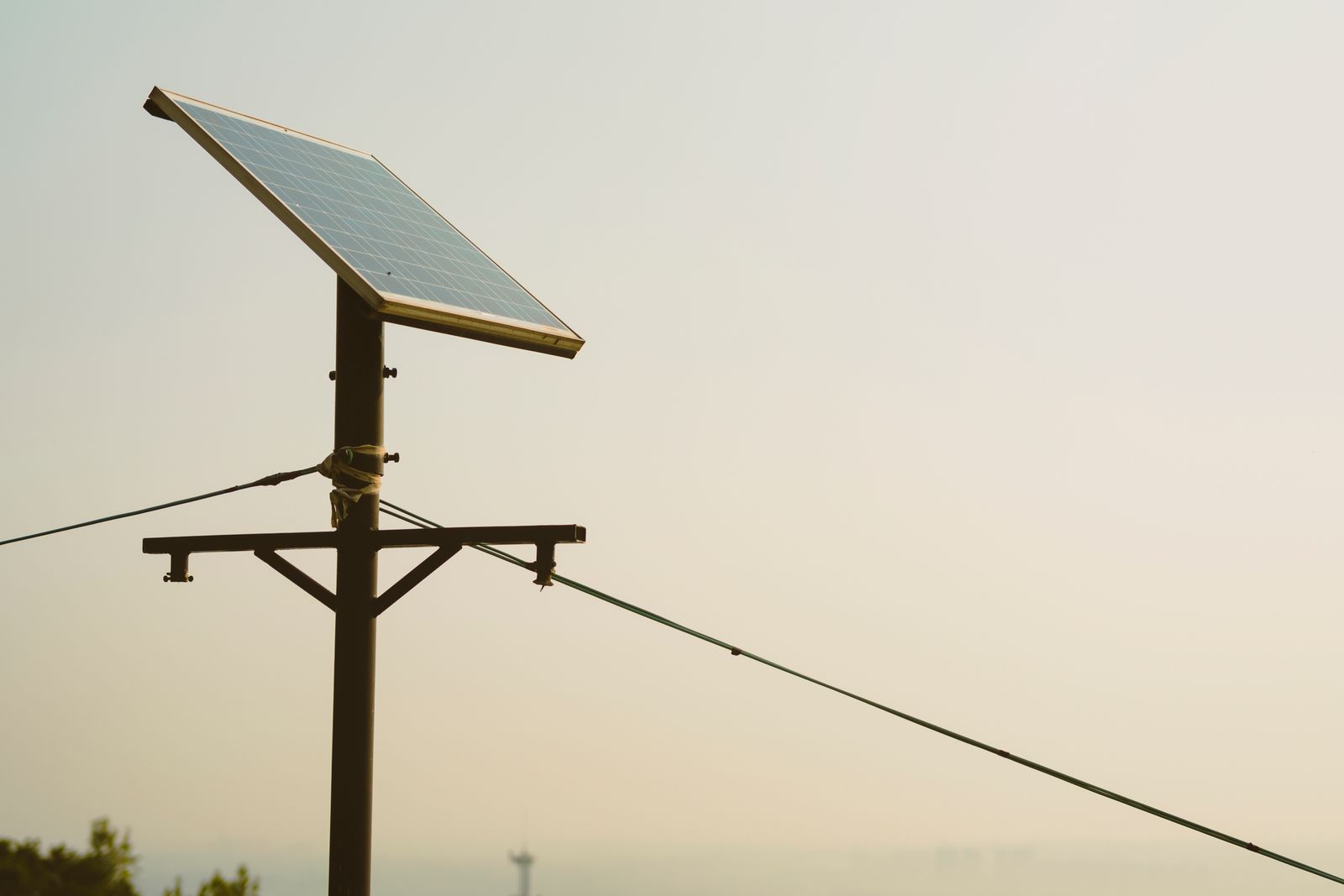 A technician completing a last-mile electricity connection in a rural community